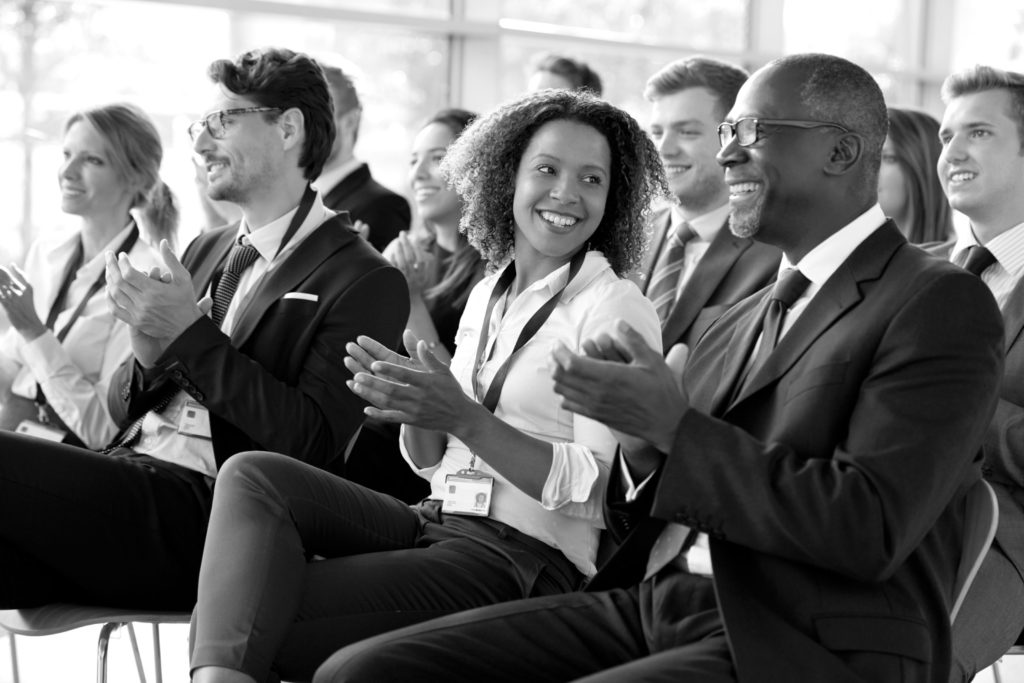 Business people clapping for a presentation