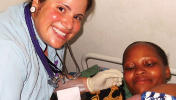Stefani Young helps a new mother at the Temeke Hospital in Tanzania with Nations Midwifery