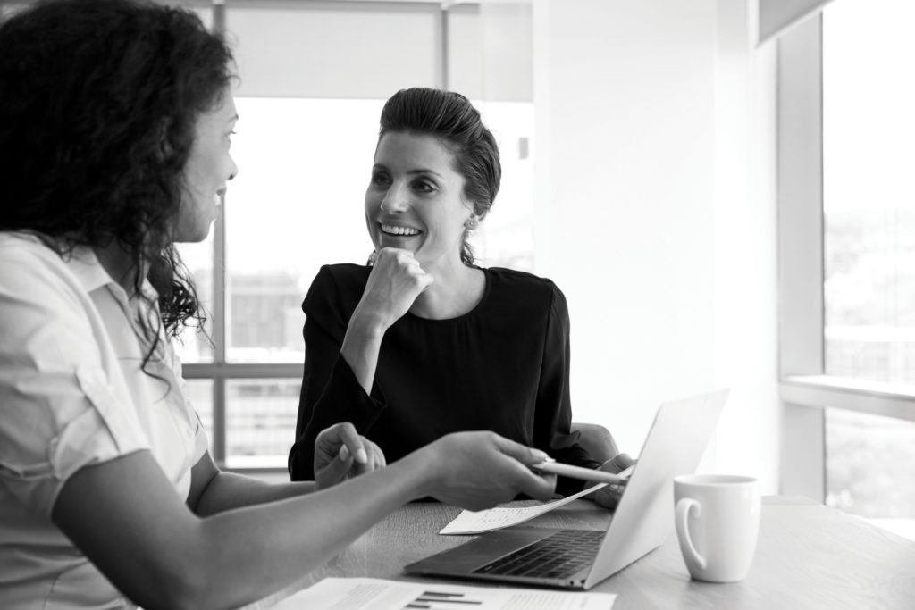 Two business women collaborating