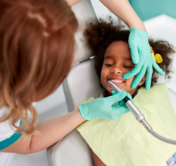 Female Hygienist and Young Girl Patient