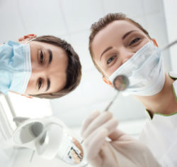 A doctor and dental hygienist on the cover of the 2018/2019 Reference Catalog