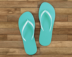 Flip flops on a wooden background