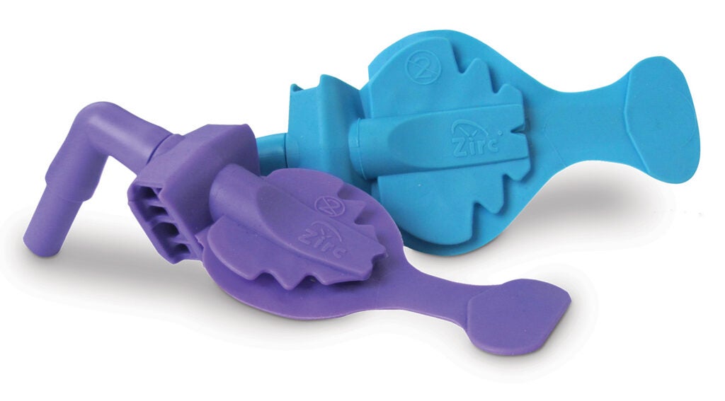 Mr. Thirsty® One-Step holds the patient open with the built-in bite block, retracts the tongue, and protects the airway from loss of any debris down the throat or into the lungs. Shown here in the blue adult size and the purple youth size.