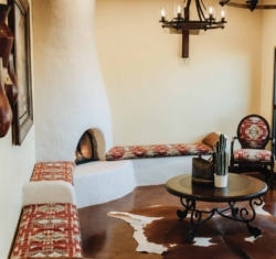 Touches of Santa Fe greet patients the moment they step into the waiting room. From the Rumford Fireplace in the corner with the built-in benches flanking the wall on either side. The upholstery echos the southwest theme in rich, warm colors. Dark wooden accents round out the space.