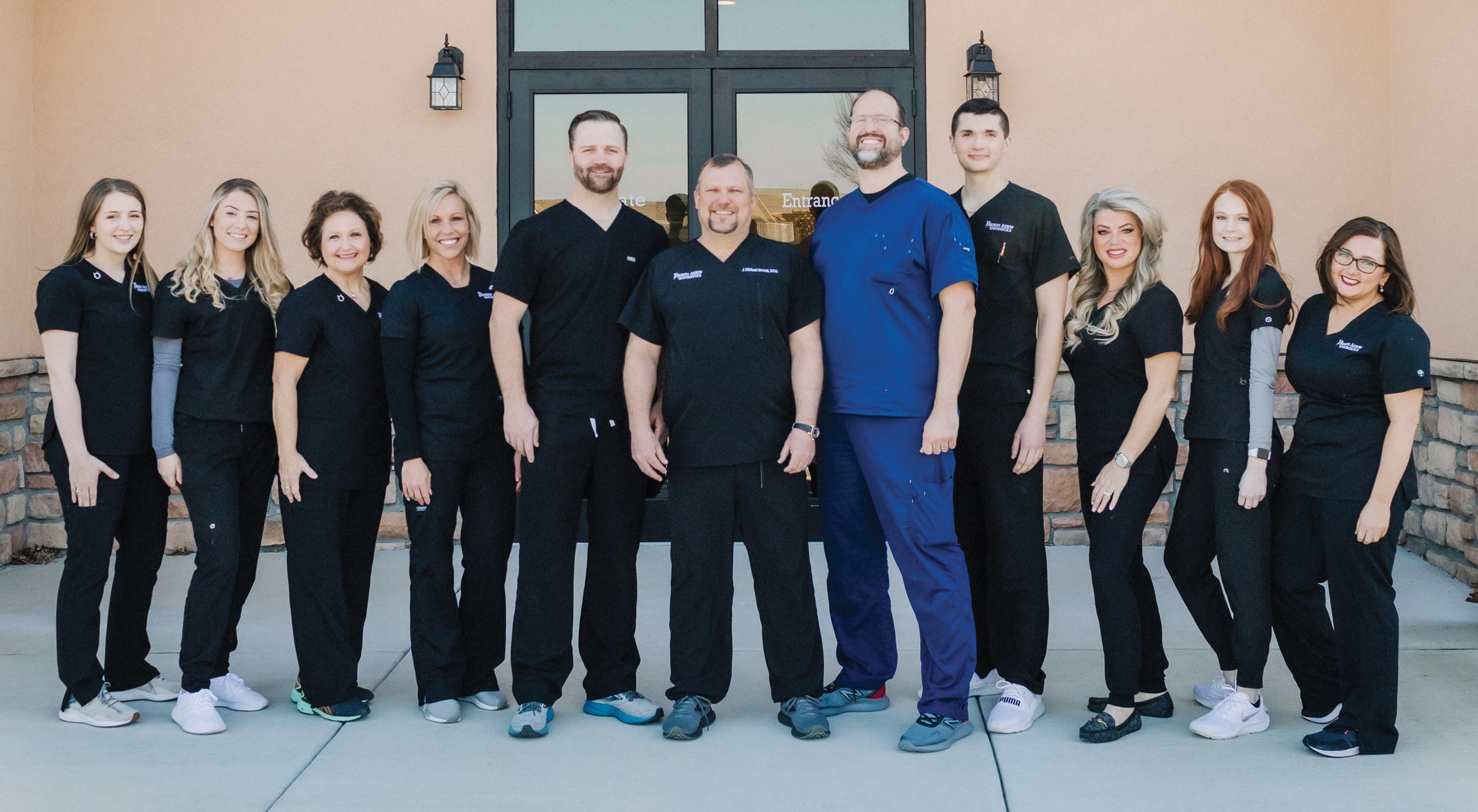 The Broken Arrow Endodontics team gathers for a group photo. Left to right: Paige Murphy, Paige Burke, Debbie Gann, Andrea Price, Dr. Ryan Gibson, Dr. Michael Strand, Dr. David Woodard, Corbin Bliss, Eve Strand, Brooke Wroten, and Katy Ashcraft.