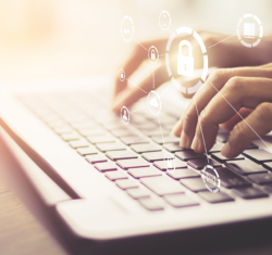 Cyber security depicted through a woman's hands on a keyboard of a laptop. Superimposed over the image are graphics of locks, emails, clouds, and other icons symbolizing our online lives.